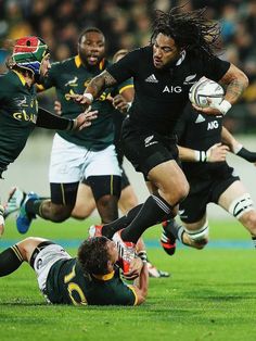 rugby players in action on the field during a game