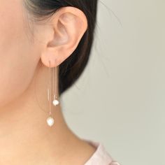 "Dainty Freshwater pearl threader earrings come in two sizes. They are lightweight and easy to put on which makes them suitable for everyday use. They would make the perfect gift idea for bridesmaids on your special day. D E T A I L S - Gorgeous organically shaped freshwater pearls - Lightweight and effortless. Suitable for everyday use - Easy to put on through wire bar ends - A freshwater pearl hanging from a delicate nickel-free chain - Each pearl is unique and irregular in shape by nature and Dainty Pearl Charm Dangle Threader Earrings, Dainty Dangle Threader Earrings With Pearl Charm, Adjustable Dangle Pearl Chain Earrings, Adjustable Dangle Pearl Earrings With Pearl Chain, Dainty White Pearl Drop Threader Earrings, White Dainty Pearl Drop Threader Earrings, White Dainty Threader Earrings With Pearl Drop, White Pearl Charm Threader Drop Earrings, Delicate Pearl Charm Threader Earrings Gift