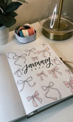 a notebook with the word january written on it