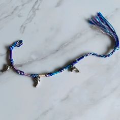 Super Cute Woven Dolphin Charm Bracelet/Anklet Perfect For Sumner! ~Design: Knotted/Braided/Other Friendship Bracelet Design ~Colors: Various Shades Of Purple/Blue/White ~3 Silver Tone Dolphin Charms ~Total Length From End To End Is 11in ~Note: Please Keep In Mind That About 2-3 Inches Of The Unwoven End Is Intended To Be For Tying It, So Depending On The Size Of Your Wrist/Ankle & How Loose/Tight You Want It To Fit, These Factors Will Determine How Much Length You Actually Have To Work With. Blue Braided Friendship Bracelets With Adjustable Length, Blue Braided Bracelet With Sliding Knot For Beach, Purple Sliding Knot Bracelet For The Beach, Blue Adjustable Braided Bracelets For Beach, Blue Hand-strung Braided Bracelets For Beach, Friendship Bracelet Knots, Dolphin Charm, Knot Braid, Bracelet Craft