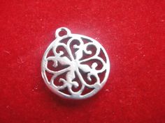 This sterling silver filigree charm or pendant is a nice piece for necklaces and bracelets and earrings. It measures about 15x12mm including loop. Oxidized to show details.1 pc.MATTE VERMEIL VERSION:   https://www.etsy.com/listing/253230654/2-pc-vermeil-18k-gold-plated-over-925For the larger quantity convo us.Thanks for stopping by Silver Pendant Charms For Jewelry Making, Silver Charms For Jewelry Making, Silver Engraved Charms For Jewelry Making, Silver Round Charms For Jewelry Making, Filigree Pendant Jewelry For Keepsake, Traditional Filigree Flower Pendant Jewelry, Silver Engraved Round Pendant Charms, Metal Filigree Round Pendant Necklaces, Festive Filigree Pendant Jewelry