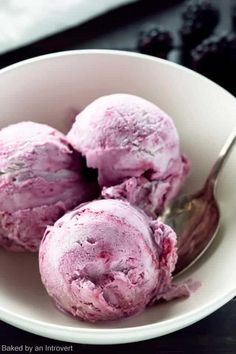 three scoops of ice cream in a white bowl