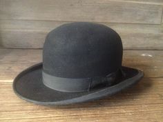 "Antique French Black Bowler Derby Hat Antique French black felted wool bowler derby hat. Leather headband with owners initials. Original black grosgrain ribbon bow and grosgrain ribbon edge. Measures; 21.5\" circumference, 4.5/5\" height, 2\" hat brim. Hat sized is marked as a 3 1/2, small size. Lovely antique condition, with fading and wear, no rips, tears or odors. Interior is clean. A bit dusty from years of storage...easy fix. There are crease marks showing at the top and the hat is somewha Classic Cloche Felt Hat, Classic Solid Color Cloche Felt Hat, Classic Black Felt Hat For Formal Occasions, Classic Fitted Cloche Hat Bands, Formal Black Wool Felt Hat, Formal Black Felt Hat With Flat Brim, Black Wool Felt Hat For Formal Occasions, Black Formal Felt Hat With Flat Brim, Classic Black Wool Cloche Hat