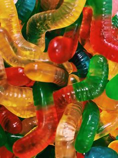 the gummy bears are all different colors and sizes, but they look like worms