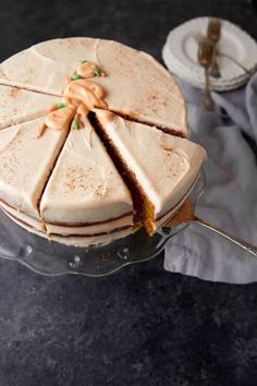 a cake sitting on top of a glass plate with a slice cut out of it