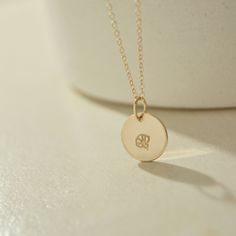 Adorned with hand-stamped Birth Flower designs, our stackable necklace captures the essence of meaningful moments. Personalize each disc with your birth month flower or gift it as a sweet token for mothers or grandmothers. Crafted with care, each disc symbolizes the cherished bond between mother and child, ensuring a heartfelt connection with every wear. Handcrafted in U.S.A Details Hypoallergenic, Water Resistant, Tarnish-free Material : 14k Gold Filled Disc Diameters: 1/4" , 1/2" Each necklace Gold-plated Birth Flower Necklaces, Gold Birth Flower Pendant Necklace, 14k Gold-filled Necklace With Birth Flower Round Pendant, Gold Flower-shaped Charm Necklace With Birthstone, 14k Gold-filled Birth Flower Pendant Necklace, Stackable Necklaces, 40th Gifts, 20 Gifts, Month Flowers