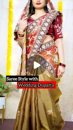 a woman in a red and gold saree with her wedding dupatta on