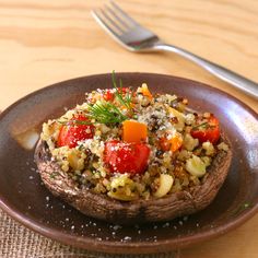 a brown plate topped with food on top of a wooden table