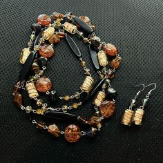 Material: Acrylic, Czech Glass, Metal, Plastic Color: Brown, Cream, Amber Measurements: Length (In): 40 Extension (In): 0 Width (In): 6/8 Drop (In): 0 Described To The Best Of My Knowledge Measurements Are Estimated Happy Shopping! Unique Brown Dangle Necklaces, Elegant Brown Multi-strand Beaded Necklaces, Brown Multi-strand Necklaces With Natural Stones, Brown Multi-strand Necklace With Polished Beads, Large Bead Necklace, Vintage Rhinestone Necklace, Vintage Brown Multi-strand Beaded Necklace, Gold Locket Necklace, Turquoise Statement Necklace