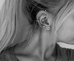 black and white photo of woman with ear piercings