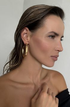 Mixed-shape cubic zirconia nestle into these generously-sized 14-karat gold-plated hoop earrings for effortless geometric glow. 2 1/4" hoop diameter Post back 14k-gold plate/cubic zirconia Imported Cubic Zirconia Hoop Earrings, Bamboo Hoop Earrings, Double Hoop Earrings, Gray Jewelry, Big Hoop Earrings, Turtle Earrings, Signature Design, Cubic Zirconia, Gold Earrings