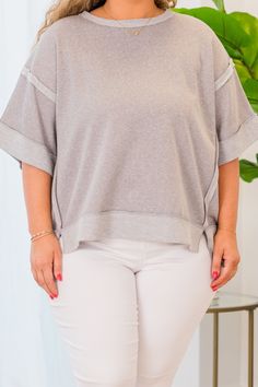 The Avoidant Top in sleet offers a versatile high-low hem and stylish contrast trim! Its drop shoulder design allows for comfortable wear, whether dressing up or down with denim or leggings! Elevate your wardrobe with this must-have piece! 46% Polyester, 39% Cotton, 15% Rayon Oversized Top With Striped Hem, Oversized Tops With Striped Hem For Spring, Oversized Spring Top With Striped Hem, Spring Oversized Top With Striped Hem, Oversized Striped Hem Tops For Spring, Fall Striped Hem Top For Loungewear, Crew Neck Tops With Striped Hem For Layering, Crew Neck Tops With Striped Hem, Gray Shirttail Hem Top For Spring