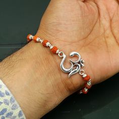 925 sterling silver handmade custom design 'Aum' Bracelet Or Rakhi with rudraksha chain, this is special design Rudraksha rakhi for Rakshabandhan Festival in India, best wishes gift for your brother and sister's , Metal-925 sterling silver. Item type-Rakhi Bracelet. Length-select length from option. Weight-6.620 grams. Aum size-2.0 cm diameter. Rudraksha size-6 mm approx. Stamped-925. Make excellent gifting and collectible pieces(gift for birthday, wedding, anniversary, mother's day, fathers day Silver Rakhi For Brother, Rudraksha Rakhi, Rakhi 2024, Silver Rakhi, Contemporary Bracelets, Rakhi Design, Rudraksha Beads, Beautiful Sketches, Dancing Aesthetic