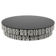 a black and white coffee table with geometric designs