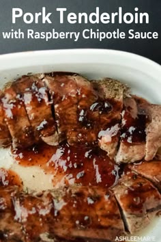 pork tenderloin with raspberry chipotie sauce in a white bowl