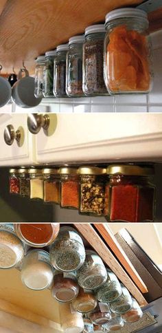 there are many jars and spoons on the shelves in this kitchen, one is filled with spices