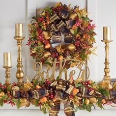 a christmas wreath on top of a mantle