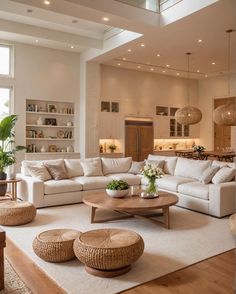 a living room filled with lots of white furniture