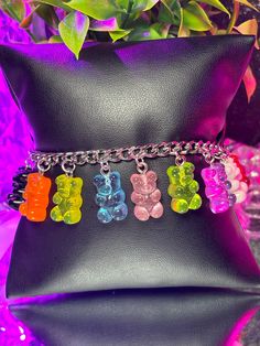 Introducing our delightful Gummy Bears Charm Bracelet – a whimsical addition to any outfit! Crafted with care, this bracelet is adjustable for the perfect fit, available in two sizes to cater to both kids and adults. For the little ones, our kid-size option starts at 5 inches and adjusts to 7 inches, while the adult size begins at 7 inches and extends to 9 inches. No matter your age, you can indulge in the charm of these sweet gummy bears! Choose between two finishes – stainless steel gold plate Pink Adjustable Themed Charm Bracelet, Adjustable Pink Themed Charm Bracelet, Pink Themed Adjustable Charm Bracelet, Cute Adjustable Charm Bracelet For Parties, Adjustable Cute Charm Bracelet For Party, Novelty Multicolor Charm Bracelet For Birthday, Cute Rainbow Charm Bracelet For Gift, Cute Rainbow Charm Bracelet As Gift, Pink Novelty Plastic Bracelets