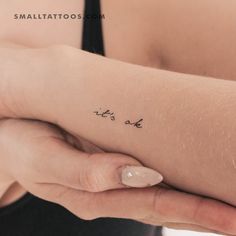 a woman's arm with writing on it