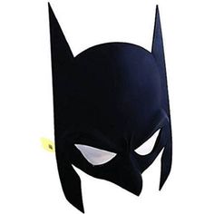 the batman mask is black with white eyes and fangs on it's face,