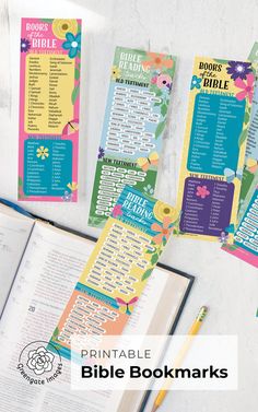 the printable bible bookmarks are laid out on a table next to an open book