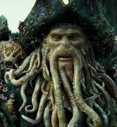 an image of a man with octopus tentacles on his face and beard wearing a hat