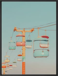 an overhead view of a ski lift with many chairs hanging from it's sides