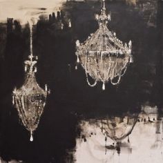 two chandeliers hanging from the ceiling in front of a black and white background