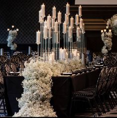 a table with candles and flowers on it