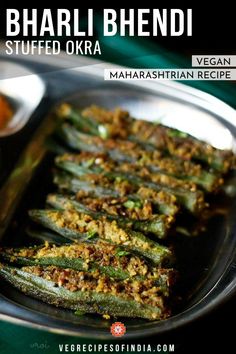 some food is on a metal plate and ready to be eaten with sauces in the background