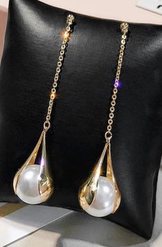 Long Chain drop Pearl Earrings Make a statement wearing these lovely large faux pearl earrings! Walk into the room and let these pearl earrings Sway to your inner music!!These gorgeous oversized faux pearl chain earrings are perfect for an elegant look or special occasion. They are also the perfect gift for Mothers of the Bride or Groom, The Bride or Brides Maids and Wedding Parties. Inquire for special price break on 4 or more pairs! These can be customized to what ever length you prefer.. just Trendy Pearl Earrings For Party, Trendy Pearl Earrings With Pearl Charm For Party, Luxury Pearl Chain Earrings For Formal Occasions, Trendy Party Pearl Earrings With Charm, Trendy Pearl Charm Earrings For Party, Trendy Gold Pearl Earrings For Party, Pearl Drop Earrings For Party, Pearl Charm Drop Earrings For Party, Trendy Pearl Drop Jewelry For Party