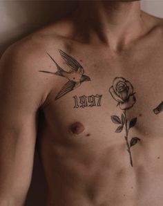 a man with a rose tattoo on his chest