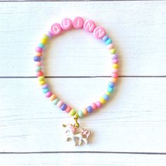 This unicorn charm bracelet is adorable! With pink letter beads and pastel czech beads it's a great present! Personalize this gift with any name or saying on it. Kids love custom gifts, made especially for them! Please check all selections and spelling prior to check out. Our custom bracelets are made to order so all sales are final. The bracelets are beautifully packaged and ready to gift. Receipts are never included in your package. If you want to include a special note, please let me know in Personalized Pink Whimsical Bracelet, Personalized Whimsical Pink Bracelet, Whimsical Personalized Pink Bracelet, Playful Beaded Charm Bracelet For Birthday, Pink Letter Beads Friendship Bracelets For Party Favors, Playful Pink Letter Beads Charm Bracelet, Cute Charm Bracelet With Letter Beads For Birthday, Playful Charm Bracelet With Letter Beads For Birthday, Playful Letter Beads Charm Bracelet For Birthday