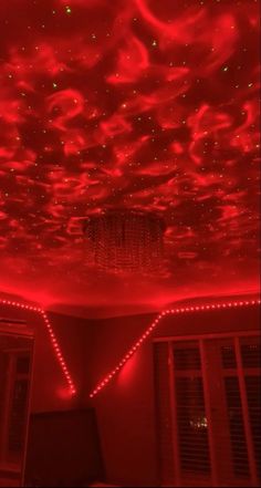 the ceiling is covered in red lights and stars