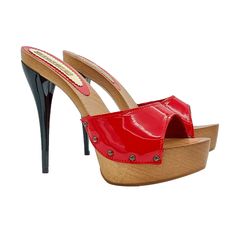 The red patent leather clogs have an attitude that will be the envy of all. Ideal to choose for refined ceremonies and events, our clogs characterized by an elegant and sinuous line, promise a sophisticated and feminine style. Clogs with brown wooden base Red patent butterfly band 14 cm black lacquered stiletto heel with 3.5 cm plateau Stable and comfortable made entirely in ITALY. Craftsmanship. BEFORE COMPLETING YOUR PURCHASE DO NOT FORGET TO CHECK THE SIZE! Elegant High Heel Clogs With Reinforced Heel, Elegant Platform Clogs With Open Heel, Elegant Open Heel Platform Clogs, Luxury Party Heels With Wooden Heel, Party High Heel Mules With Red Sole, Elegant Open Heel Clogs For Party, Party Platform Clogs With Open Heel, Chic High Heel Clogs For Party, Chic High Heel Party Clogs