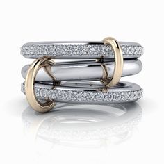 Get ready to stack in style with our Connected Rings, Link Stacker No. 9! This modern stacking set, available in silver or gold, will add a touch of flair to any outfit. Connected Rings: (1) Plain Band 3mm round (2) Bands 3mm round, Colorless Moissanite or upgrade to Lab Grown Diamonds, GH Color, SI1 Clarity. (2) Link Connectors .75 carat total weight. Connected Rings Sizing, Order your normal size. *The ring is custom made just for you in your ring size and metal preference. Luxury Modern White Gold Stackable Rings, Modern Stackable Rings With Brilliant Cut Open Design, Modern Stackable White Gold Rings, White Gold Stackable Open Ring With Vvs Clarity, Luxury White Gold Stackable Open Ring, Elegant White Gold Stackable Rings, Vvs Clarity Cubic Zirconia Stackable Open Rings, Connected Rings, Linking Rings