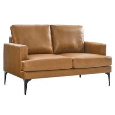 a tan leather couch with black legs