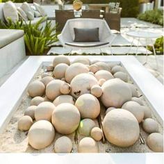 there are many rocks in the sand on this patio