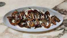 a white plate topped with lots of food on top of a marble counter next to the words eyeswoon mirage