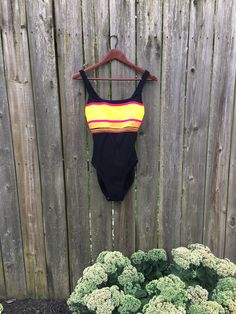 Vintage 90's Christina Orange, Yellow, Pink Striped One Piece Black Swimsuit Labeled Size 14 Fits Smaller by VintageVanShop on Etsy Multicolor Bodysuit For Summer Music Festival, Summer Music Festival Stretch Bodysuit, Black Stretch Swimwear For Music Festival, Stretch Bodysuit For Summer Music Festival, Multicolor Summer Swimwear For Music Festival, Fitted Swimwear For Music Festival, Fitted Black Swimwear For Music Festival, Black Beachwear Leotard For The Beach, Sleeveless Swimwear For Summer Music Festival