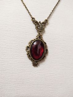 ◆ Victorian style necklace. The red blood cabochon size is 0.984252 x 0.708661 inches and it was completely handmade in resin. The inserts, the base and the chain are in bronze, The product is made by hand with great care. ♡ In my shop there are many handmade jewelry for all tastes, come and watch them are welcome! ♡ Red Amulet Necklace, Red Vintage Jewelry, Red Gem Jewelry, Blood Jewelry Diy, Red Necklace Aesthetic, Red Jewelry Aesthetic, Red Stone Jewellery, Dark Red Jewelry, Red Gem Necklace