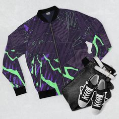 "Men's Bomber cyberpunk jacket, zip up jacket, futuristic jacket, cyberpunk art, psychedelic jacket glitch abstract green purple black colorful Looking fashionable has never been easier with this men's all-over print jacket with ribbed stand-up collar, elastic cuffs, and elasticized hem. Featuring the classic bomber jacket look, a durable zipper and two pouch pockets, this jacket is ready to take your everyday look a notch higher to reflect your unique personality and style. * 100% Polyester - This extremely strong and durable synthetic fabric retains its shape and resists wind, sun and rain * Full front zipper closure * Two lined welt pockets at front - Self lined slanted pockets at the sides * Dark blue polyester lining * All over print - Print covers the entire jacket * Rib Knit - The j Cyberpunk Fitted Outerwear For Streetwear, Fitted Techwear Track Jacket For Streetwear, Fitted Green Track Jacket For Streetwear, Fitted Purple Outerwear For Streetwear, Fitted Graffiti Print Outerwear For Streetwear, Rave Style Black Winter Outerwear, Black Rave Outerwear For Winter, Green And Purple Outfit, Jacket Cyberpunk