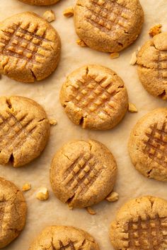 peanut butter cookies are arranged on parchment paper