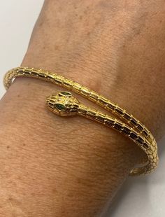 Vintage snake bangle bracelet 9k gold filled Adjusts to fits a small to average wrist All jewelry is shipped free in the US in a nice gift box. Check out our over a THOUSAND great reviews Engraving is $4 per letter and is not always perfect depending on the piece. It can take a few days if the jeweler is busy. This is payable to Paypal Judithsltd@gmail.com Gold Snake Bracelet, Gold Flexible Snake Chain Bracelet, Yellow Gold Beaded Bracelet As A Gift, Adjustable Snake-shaped Bangle For Gifts, Adjustable Snake Bangle Gift, Adjustable Snake Bangle For Gift, Elegant Yellow Gold Snake Bracelets, Elegant Snake-shaped Bangle For Gift, Gold Plated Snake-shaped Jewelry Gift