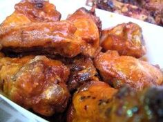 some food is in a white bowl on a table and it looks like they are fried