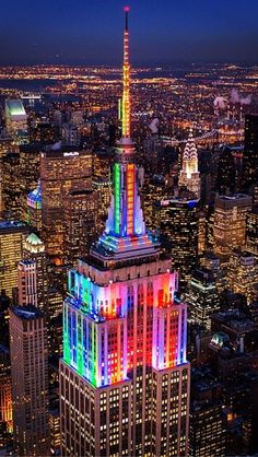 the empire building lit up in rainbow colors