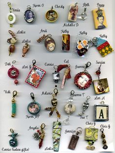 a white board with many different types of charms attached to it's sides and names