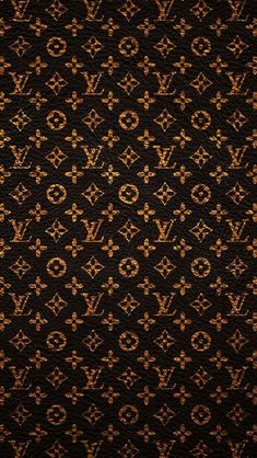 an old wallpaper pattern with gold and brown designs on black background, including the letter g