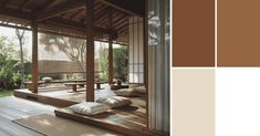 the interior of a japanese style house with wood flooring and walls in shades of brown